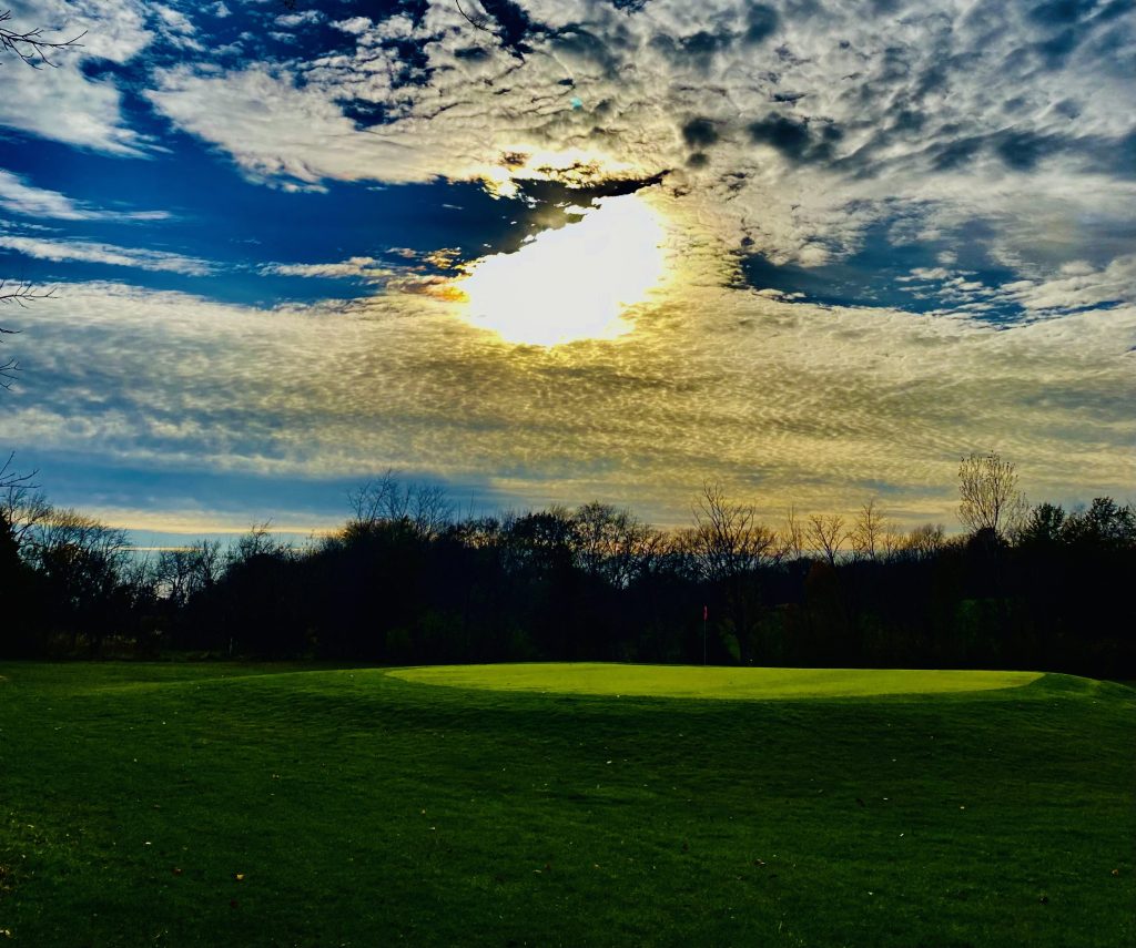 golf course with clouds overhead